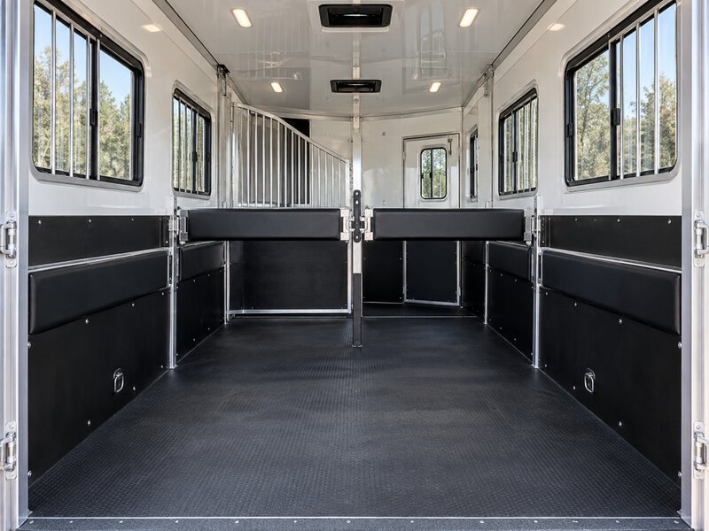 Horse trailer wall liner with a padded center divider between two stalls
