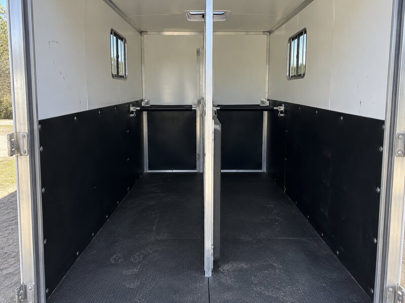 HDPE wall liner installed in a two-horse slant load trailer with padded dividers
